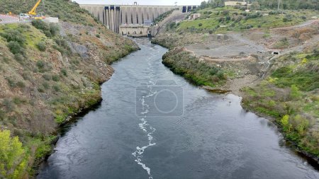 Tagus River downstream from Alcantara Dam, aka the Jose Maria de Oriol Dam - Alcantara II, buttress dam built in 1969, Alcantara, Caceres, Spain - March 9, 2024