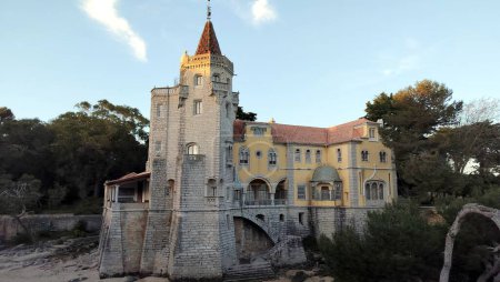 Revivalist-style Palace of the Counts of Castro Guimaraes, built in 1900, currently a museum, view in sunset light and shadows, Cascais, Portugal - March 5, 2024