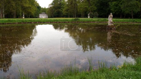 Pond in the park of the Fasanerie Castle, view in the early evening twilight, Eichenzell, near Fulda, Germany - May 10, 2022