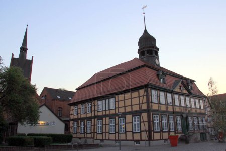 Town Hall, historic half-timbered building on the Market Street, view at sunset, Grabow, Germany - May 1, 2012