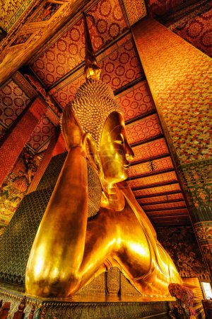 Photo for Famous golden reclining buddha statue in Buddhist temple at wat pho travel destination and tourist attraction in Bangkok Thailand - Royalty Free Image
