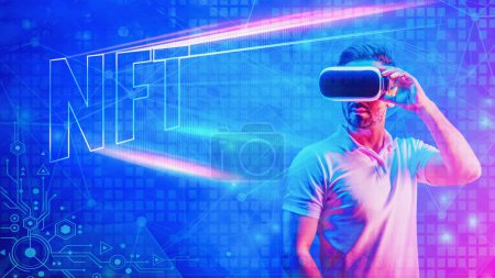 Photo for NFT on blockchain tecnology platform background of man waering 3D vr headset with NFT sign on neon color background with digital symbol in concept of using NFT technology on metaverse - Royalty Free Image