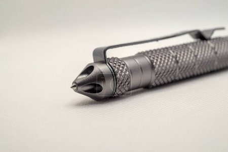 Photo for Fragment of tactical ballpoint pen on a white background - Royalty Free Image