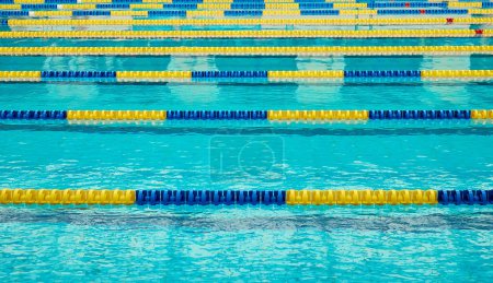 Photo for Turquoise swimming pool lanes, a symbol of sport - Royalty Free Image