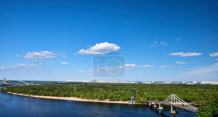 Panoramic view of the Dnipro River and the pedestrian bridge to Trukhanov Island in Kyiv, Ukraine.