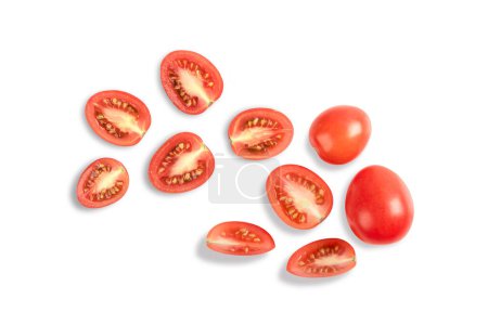 red tomatoes with whole and slices on white background