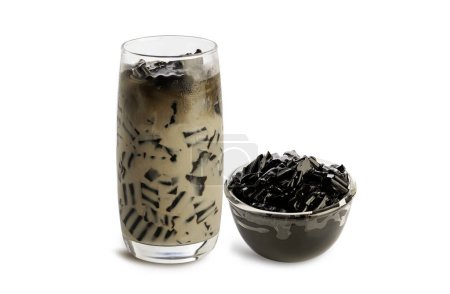 Grass jelly with milk glass and jelly in glass bowl  isolated on white background.
