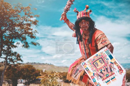 Photo for Representation of an Inca warrior dressed and with battle weapons, a pre-Hispanic warrior fighting with a tourist in Peru. - Royalty Free Image
