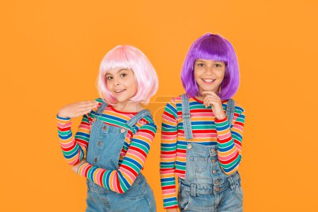 Photo for Anime cosplay party concept. Happy little girls. Anime fan. Cheerful friends in colorful wigs. Anime convention. Animation style characterized colorful graphics vibrant characters fantastical themes. - Royalty Free Image