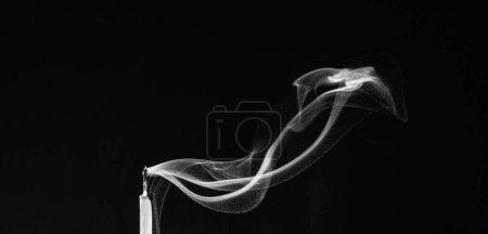 Photo for Dying out candle, candle with steaming smoke on black background, copy space. spiritual ritual. - Royalty Free Image