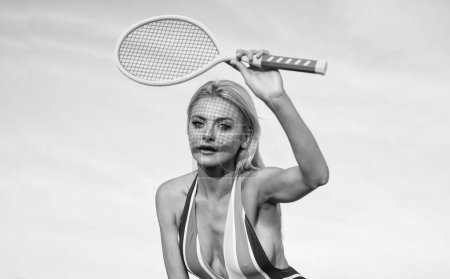 Photo for Summer activity. active lifestyle. girl in bikini on beach with racket. sportswoman in beachwear. sexy woman in striped colorful swimsuit. female tennis player. badminton racquet. sport and hobby. - Royalty Free Image