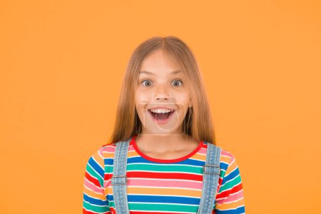 Photo for Happy childrens day. childhood happiness. cheerful hipster girl colorful clothes. optimist concept. small girl yellow background. summer kid fashion. kid positive mood. Child happiness portrait. - Royalty Free Image