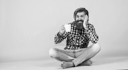 Photo for Need some coffee for inspiration. perfect start of the day. happy bearded man drinking morning coffee. man drink hot tea from cup. good morning to you. energetic warm beverage. copy space for ad. - Royalty Free Image