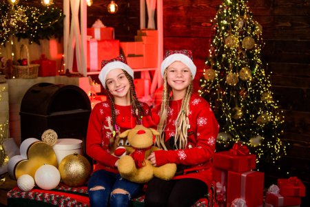 Photo for Home is best place in world. spend family holiday together. santa children toy bear. winter shopping sale kid store. Christmas party time. Happy Holidays. small girls has xmas mood. Happy New Year. - Royalty Free Image