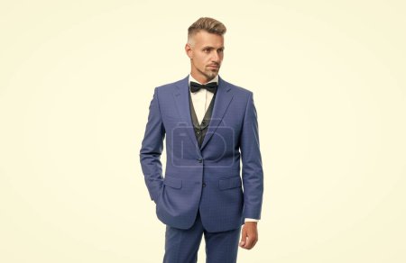 Foto de Grizzled man in bow tie blue suit. businessman isolated on white. gentleman in formal wear. - Imagen libre de derechos