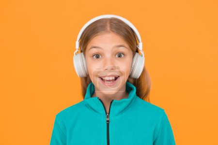 Photo for Happy song makes her smile. Happy small girl listen to music on yellow background. Little child enjoy song playing in headphones. Smile on happy face. Music has happy emotions. - Royalty Free Image