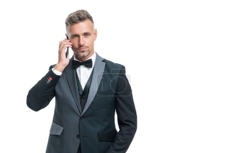 Photo for Entrepreneur in tuxedo speak on smartphone isolated on white background. - Royalty Free Image