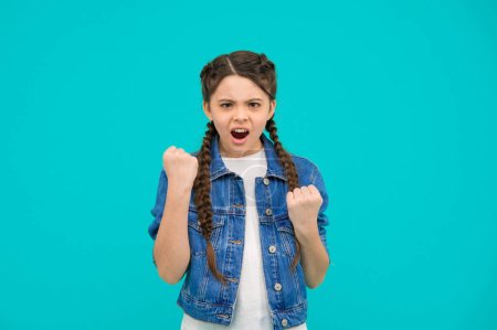 Photo for Lost her temper. Bad girl. Angry kid shake fists blue background. Bad behavior. Aggression and negativity. Anger and annoyance. Naughty and terrible. - Royalty Free Image
