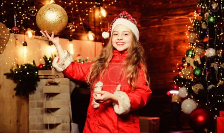 Photo for Lets do this. Happy new year. Elf child. Xmas tree. Holiday shopping. Little girl in red hat. Shopping day. Santa claus little girl. Christmas shopping. Christmas time. Shopping sale. - Royalty Free Image