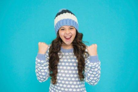 Photo for Happy kid in warm sweater selebrate success. keep head in warmth. cozy and comfortable. best winter fashion for active rest. healthy child wearing knitwear. happy childhood. teen girl with cute smile. - Royalty Free Image
