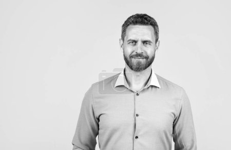 handsome smiling bearded businessman in shirt, copy space, business.
