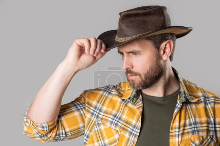 Photo for West man with cowboy hat isolated on grey background. west man in cowboy hat in studio. photo of west man wearing cowboy hat. west man wear cowboy hat. - Royalty Free Image