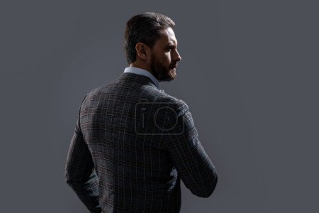 Photo for Back view photo of man wearing menswear. man wear menswear formal suit. man in menswear isolated on grey background. menswear for man in studio. - Royalty Free Image