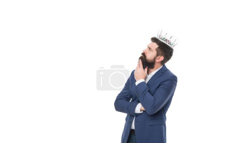 thinking businessman winner with crown isolated on white background. businessman winner wear crown in studio. photo of businessman winner in crown and suit. businessman winner in crown with copy space