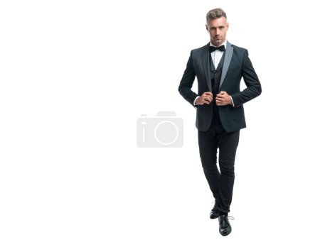grizzled man bridegroom in rich tux bow isolated on white background. full lentgh.