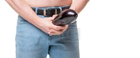Photo for Guy crop view holding eggplant at crotch level imitating penis male enhancement isolated on white, copy space. - Royalty Free Image