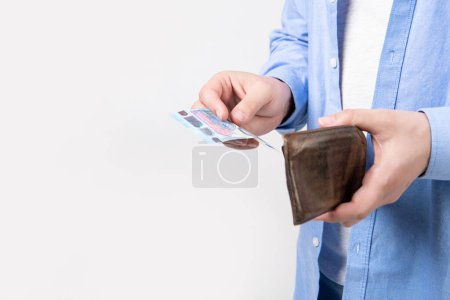 Photo for Moneyless man with wallet isolated on studio background with copy space. moneyless man with wallet in studio. moneyless man with wallet at hand. photo of moneyless man with wallet. - Royalty Free Image