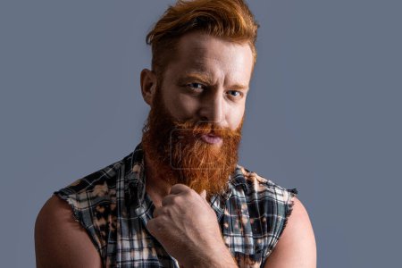 Photo for Adult brutal bearded guy on background. photo of brutal bearded guy with beard. brutal bearded guy isolated on grey. brutal bearded guy in studio. - Royalty Free Image