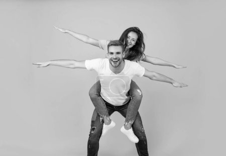 Photo for Spread your wings and fly away. Happy woman enjoy riding piggyback on guy. Couple in love having fun. Enjoy every moment. - Royalty Free Image