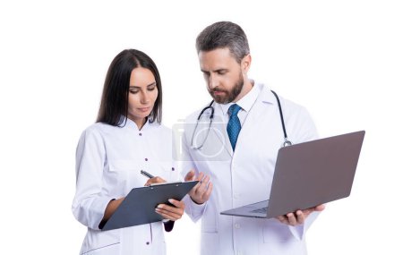 Photo for Doctor and internist do ehealth noting isolated on white. doctor with internist noting ehealth. doctor and internist wear white coat and noting ehealth. internist and doctor with laptop and anamnesis. - Royalty Free Image
