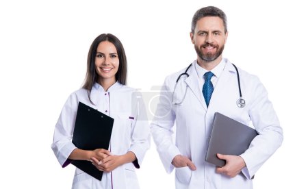 Photo for Hapy doctor with internist in studio. photo of doctor and internist wear white coat. internist and doctor with laptop and anamnesis. doctor and internist isolated on white background. - Royalty Free Image