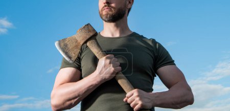 Photo for Cropped view of strong man with ax. caucasian man hold ax. brutal man on sky background. - Royalty Free Image