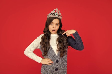 Photo for Selfish child in crown. self confident queen. expressing smug. arrogant princess in tiara. proud kid point finger on herself. egoistic teen girl wear diadem. arrogance and selfishness. - Royalty Free Image