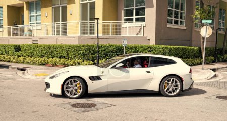 Photo for Miami Beach, Florida USA - April 15, 2021: white Ferrari 458 Spider turning on road, side view. luxury sport car. - Royalty Free Image