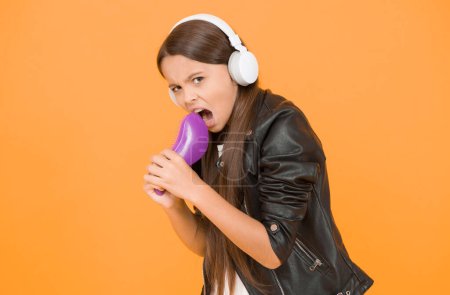 Face the music. singing karaoke. singer leather jacket. child listen rock music. school radio dj. hipster urban style girl. kid in headset. small girl sing favorite song. imagine you are pop star.
