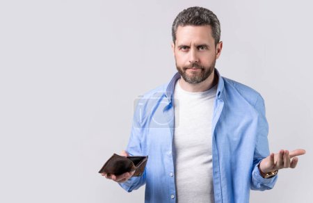 Photo for Moneyless man with wallet at hand, copy space banner. photo of moneyless man with wallet. moneyless man with wallet isolated on studio background. moneyless man with wallet in studio. - Royalty Free Image