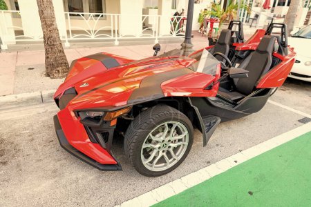 Photo for Miami Beach, Florida USA - April 15, 2021: red polaris slingshot sl, corner view. three-wheeled motorcycle. - Royalty Free Image