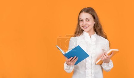 happy child in white shirt ready to study do homework read book on yellow background copy space, nerd.