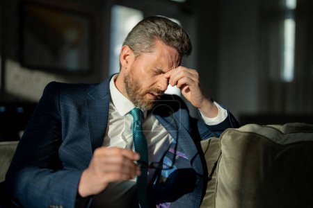 Photo for Frustrated businessman suffering from migraine at home. frustrated businessman has migraine during the day. frustrated businessman has migraine pain. photo of frustrated businessman has migraine. - Royalty Free Image