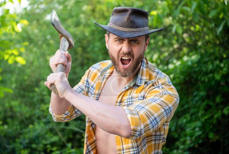 Photo for Angry lumberjack shout with axe outdoor. photo of angry lumberjack with axe. angry lumberjack with axe. angry lumberjack with axe wearing checkered shirt. - Royalty Free Image