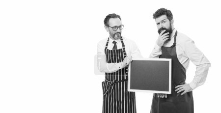Photo for Food quality. menu planning. chef in apron. catering business. welcome on board. bearded men with blackboard, copy space. partners celebrate start up. cafe and restaurant opening. best quality here. - Royalty Free Image