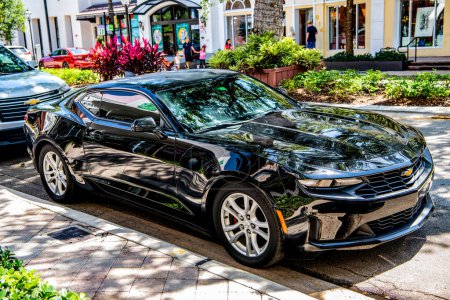 Photo for Miami, Florida USA - March 25, 2023: black 2016 Chevrolet Camaro 1LT Chevy car vehicle, side view. - Royalty Free Image