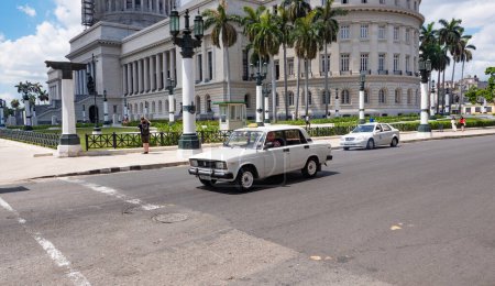 Photo for Havana, Cuba - May 02, 2019: National Capitol Building with moskvitch azlk car. - Royalty Free Image
