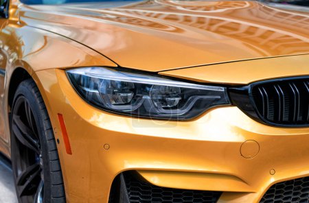 Photo for Miami Beach, Florida USA - April 15, 2021: front light lamp of yellow bmw m4 car. - Royalty Free Image