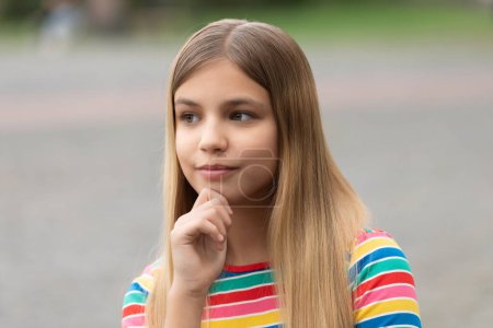 Photo for Portrait of thinking teen girl. portrait of teen girl with blonde hair. portrait of teen girl outdoor. portrait photo of teen girl outside. - Royalty Free Image
