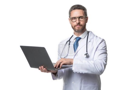 Photo for Doctor presenting emedicine on background. image of emedicine and doctor man with laptop. doctor promoting emedicine isolated on white. doctor offering emedicine in studio. - Royalty Free Image